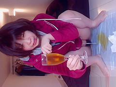 Oriental fills glass of urinate