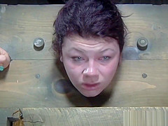 Restrained sub whipped whilst anally hooked