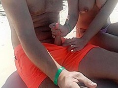 On The Beach, A Stranger Gives A Tugjob In Public