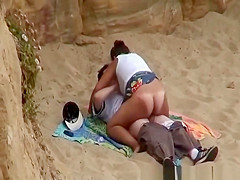 Plump cutie rides boyfriends penis in beach