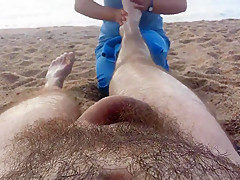 Undressed massage on the beach