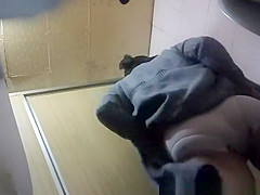 Oriental woman taking a lengthy pee