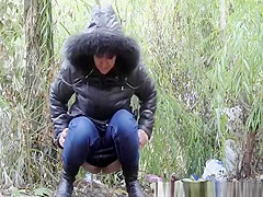 Woman peeing in the nature