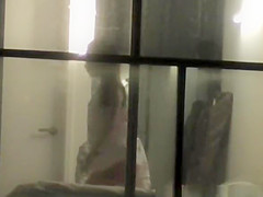 Voyeur neighbour films pair throughout window