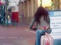 Red strap woman riding bike