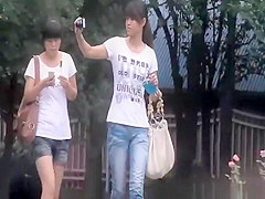 Oriental tourist taking pee