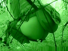 Blond caught pissing beyond some trees