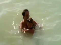 Nudist pair caught fucking in the water