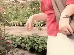 Smelling flowers whilst a boobie falls out