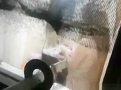 Voyeur peeping throughout the washroom window