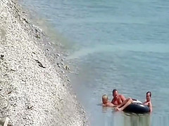 Nudist pair fucking in the water and shore