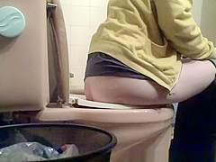 Angel lifts lavatory seat and seats to take a pee