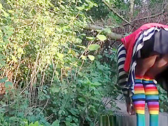 Sweetheart bows over and exposes darksome snatch