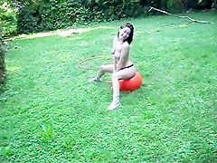 Stripped in her garden