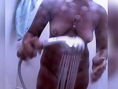 In Nature's Garb redhead reads on the beach