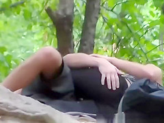 Pair making out in park