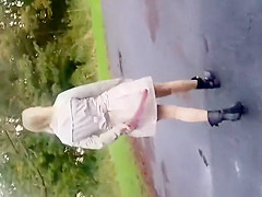 Wife widens her arse below a coat