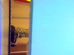 Woman spied taking off her garments in tanning room