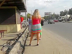 Fake blond woman wears red pants