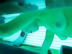 Woman spied in tanning daybed