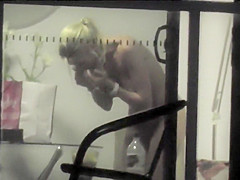 Saucy chickie receives caught on tape taking off her clothing