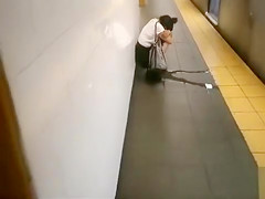 Drunk coed relieves herself at a metro station
