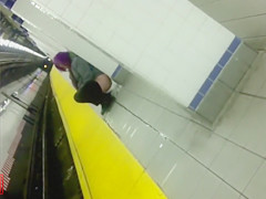 Nasty purple-haired chick makes water at the subway
