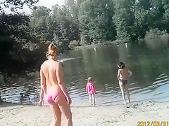 Sunny day at the nudist camp by the river