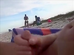 Slutty dad makes water and jerks off his weenie on a dark hottie at the beach