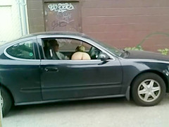 Bare hooker gives oral sex in the car and receives filmed
