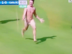 Streaking boy runs around the football pitch