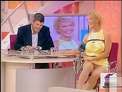 Italian diva in a short yellow suit shows off her lengthy legs