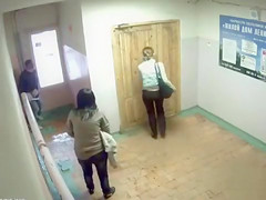 Peeing gals caught on security camera in the lobby