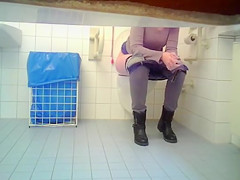 Irresistible chick takes a lengthy urinate in the restroom