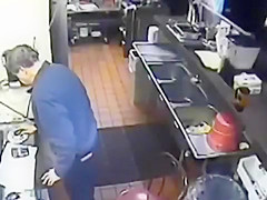 Naughty employee takes a pee into the sink