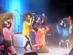 Painted scones bounce around on the stage at a rock concert