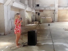 Sexy and voluptuous golden-haired runs around the building exposed