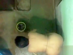 Spying on a desi woman washing her garments bare