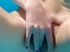 Exposed beauty sucks my pecker in the pool