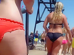 Large female gazoo in an orange bikini is stunning