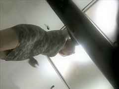 Woman tries on a skintight costume