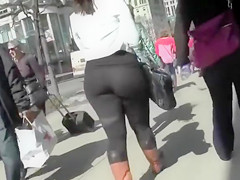 Large a-hole woman walks the town streets in spandex