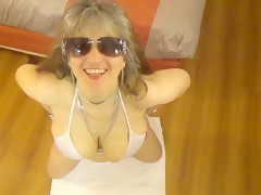 Tinja stretches a white string bikini in 6 inch stilettos