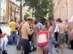 Nudists take a stroll throughout the town streets