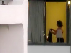 Imposing neighbour changes her clothing