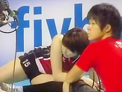 Oriental volleyball cuties stretch previous to a match