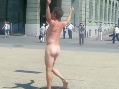 Undressed dude runs around a public square and acquires attention
