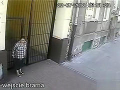 Elder lady taking a drip on the street