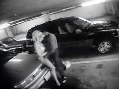 Parking garage sex on security camera with a bewitching golden-haired