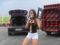 Legal Age Teenager Latin Babe dancing and singing in a parking lot